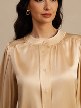 [Champagne] Woman wearing a champagne silk blouse with round neck, long lantern sleeves and button closure 005
