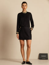 Black silk pleated stand collar blouse with gold trim and button details
