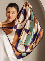 Geometric mulberry silk square scarf with navy, gold, ivory and mint pattern