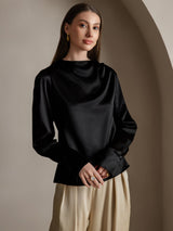 Black silk long sleeve boat neck blouse with pearl-style cuffs