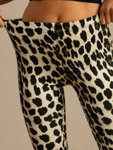 High-waisted silk jersey flare pants with black leopard print