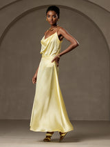 Model wearing pale yellow silk A-line maxi skirt with lining and matching draped top
