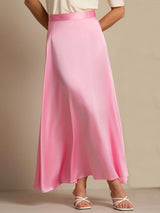Pink silk A-line maxi skirt with lining and side zip, styled with white sandals