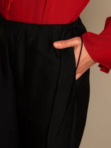 Black silk-wool blend straight-leg pants with drawstring waist and side pockets