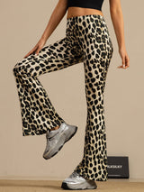 High-waisted leopard print silk flare pants in black and cream with slim fit