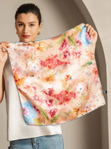 Woman holding 53x53cm mulberry silk floral scarf with colorful watercolor flowers