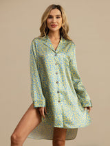 Woman wearing yellow blue leopard print silk nightshirt with notch collar and high-low hem