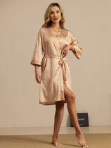 Model wearing knee length pure silk kimono robe with heart geo print and belted waist