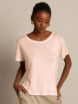 Model wearing light pink silk jersey short sleeve round neck women's T-shirt