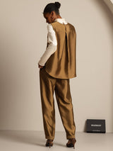 Back view of a silk-wool blend women's vest and matching pants in caramel brown