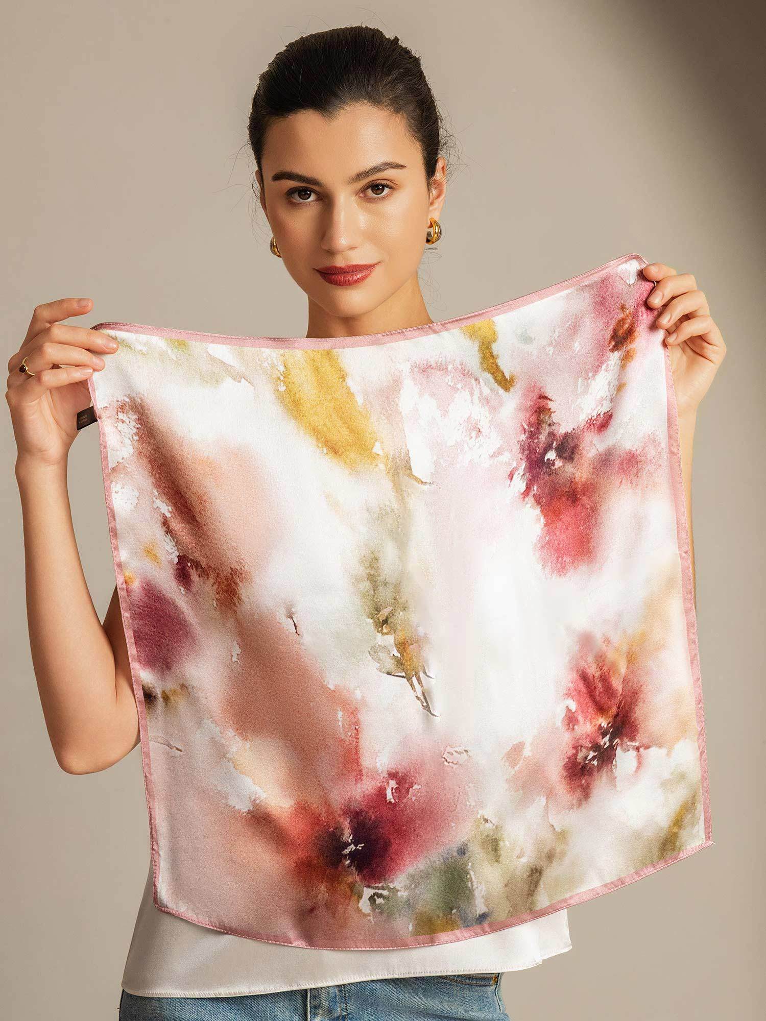Woman holding pink-trim floral Mulberry silk square scarf, 53x53 cm