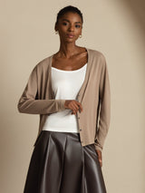 Model wearing taupe 100% mulberry silk V-neck long sleeve cardigan with button front