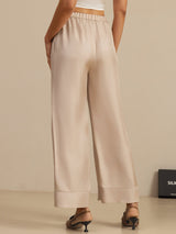 Beige silk twill high-waist full-length pants with elastic waistband and wide legs