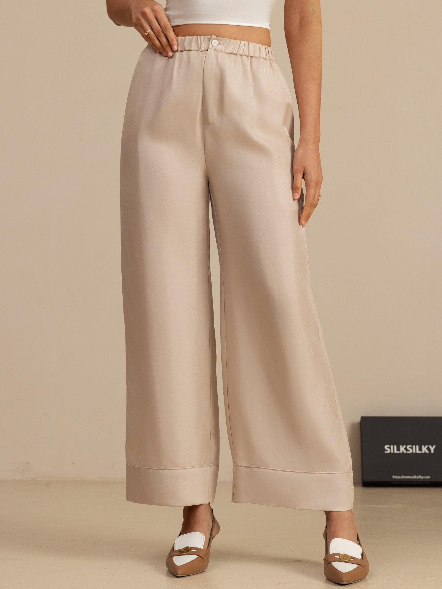 Beige high-waist full-length silk twill pants with elastic waistband and side pockets