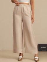 Beige high-waist full-length silk twill pants with elastic waistband and side pockets