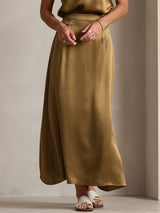 Gold silk A-line maxi skirt with side zipper and flowing drape