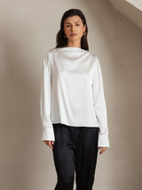 White silk long sleeve boat neck blouse with pearl button shoulder detail
