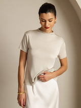 Model wearing cream pure silk short sleeve mock neck T-shirt