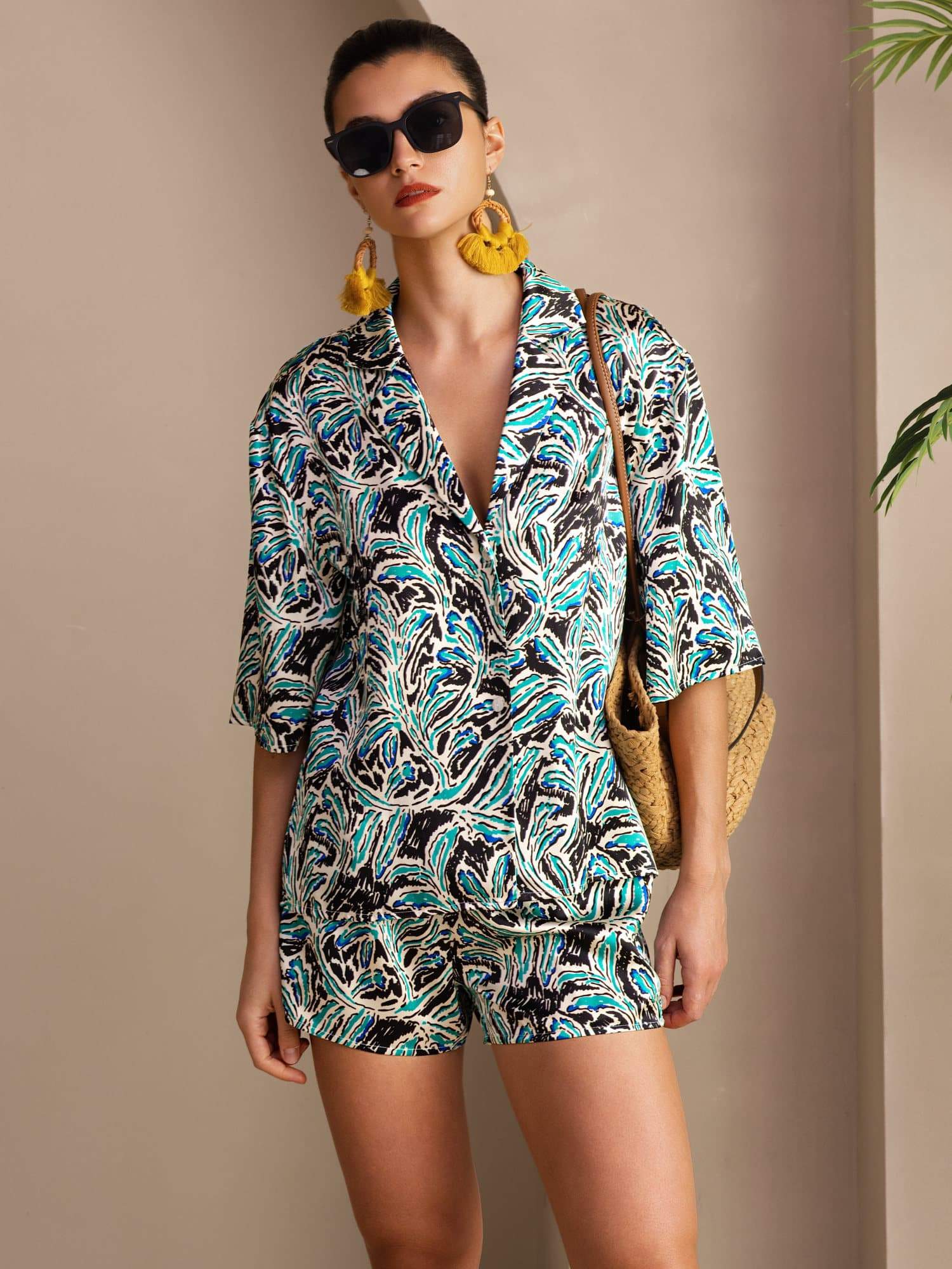 Women’s botanical print silk pajama set with short sleeve button-up shirt and shorts