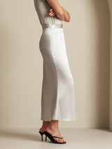 Beige silk A-line maxi skirt with side zipper, shown with fitted satin top