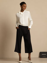 White silk long sleeve stand collar bow blouse with black wide-leg pants