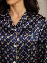 Navy silk pajama top with gold geometric chain print, notch collar and contrast piping