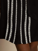 Black silk tie-neck shirt dress with white vertical lace pleats