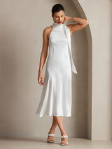 White sleeveless silk midi dress with tie neck and straight fit