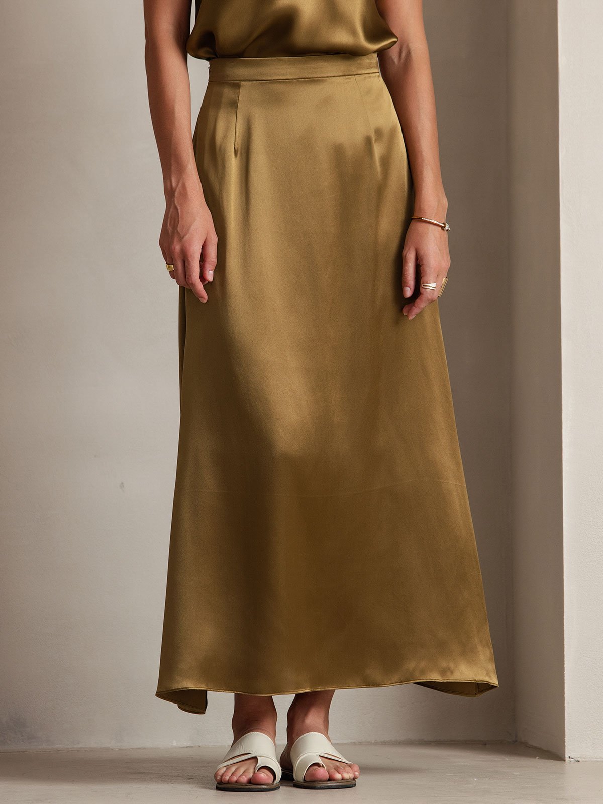 Olive silk A-line maxi skirt with side zip, flowing bias cut and elegant drape