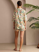Back view of woman wearing multicolor crocodile print silk short sleeve pajama set