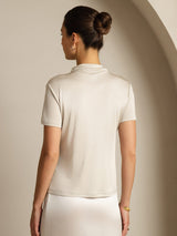 Women’s cream silk short sleeve mock neck top, back view