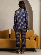 Back view of women's navy pure silk pajama set with chain print and notch collar