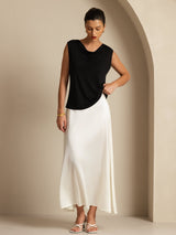 Black sleeveless cowl neck silk jersey top styled with a white skirt