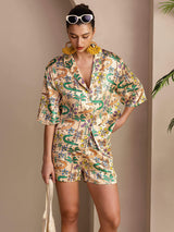 Woman wearing 19 momme mulberry silk crocodile print short sleeve button-up pajama set