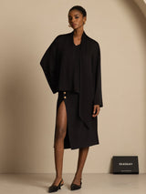 Black silk asymmetrical tie V-neck blouse with long sleeves and slit skirt styling