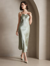 Light green silk spaghetti strap maxi dress on model