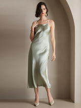 Light green silk spaghetti strap midi dress with slim fit and back tie detail