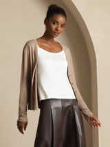 Model wearing beige 100% mulberry silk V-neck long sleeve cardigan with white camisole
