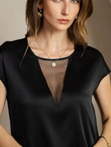 Black silk cap sleeve top with sheer V insert and round neckline