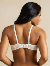Back view of woman wearing white pure silk bra with adjustable straps