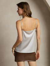 Back view of woman wearing a silver 19 momme silk spaghetti strap camisole