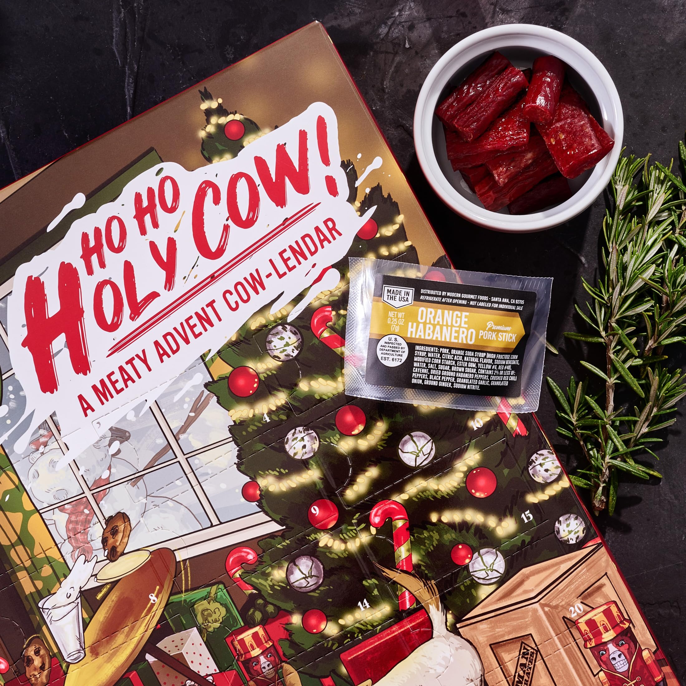 Man Crates Jerky Advent Calendar 2024 - 25 Beef Jerky Bites in Red with "Ho-Ho-Holy Cow" Artwork - Flavors: Orange Habanero, Rootbeer