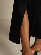 Black silk wide-leg pants with side slit showing leg