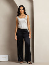 Women’s silk sleeveless U-neck tank top in ivory with black pants