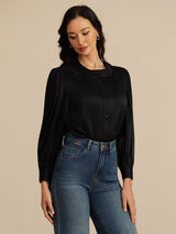 [Black] Black silk blouse with round neck, lantern sleeves, and front button closure, styled with jeans 001