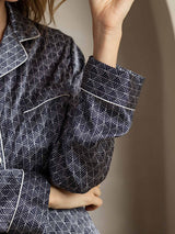 Navy silk pajama set with white ginkgo print, notch collar and contrast piping