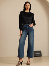 [Black] Black silk round-neck blouse with button closure and long lantern sleeves styled with wide-leg jeans 007
