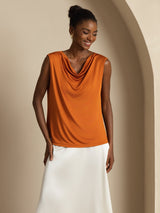Orange sleeveless silk jersey cowl neck top with draped neckline