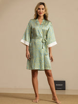 Leopard print silk kimono robe with tie waist and white cuffs