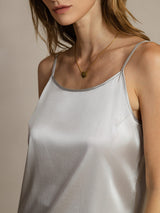 White silk spaghetti strap camisole with round neck and fitted silhouette